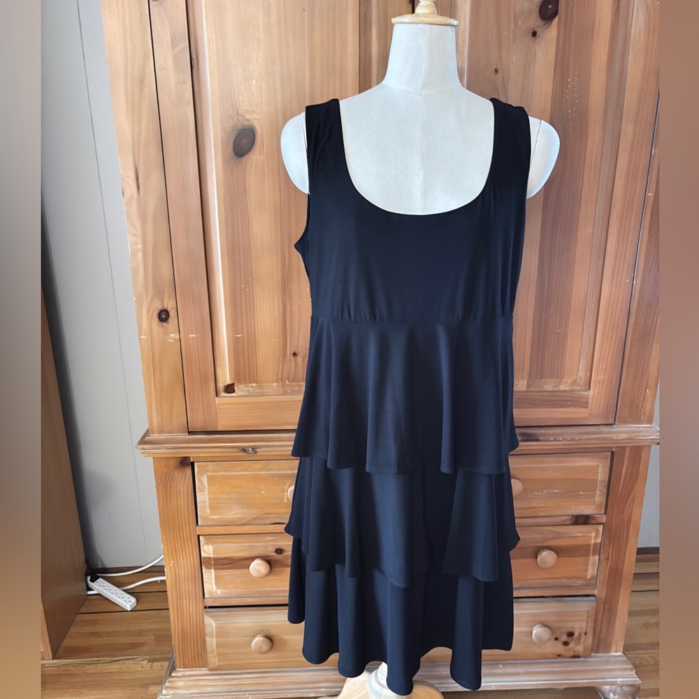 Tiana B, Black tiered sleeveless ruffle dress.
Size Large
